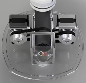 The AutoTrickler rests on a clear acrylic panel